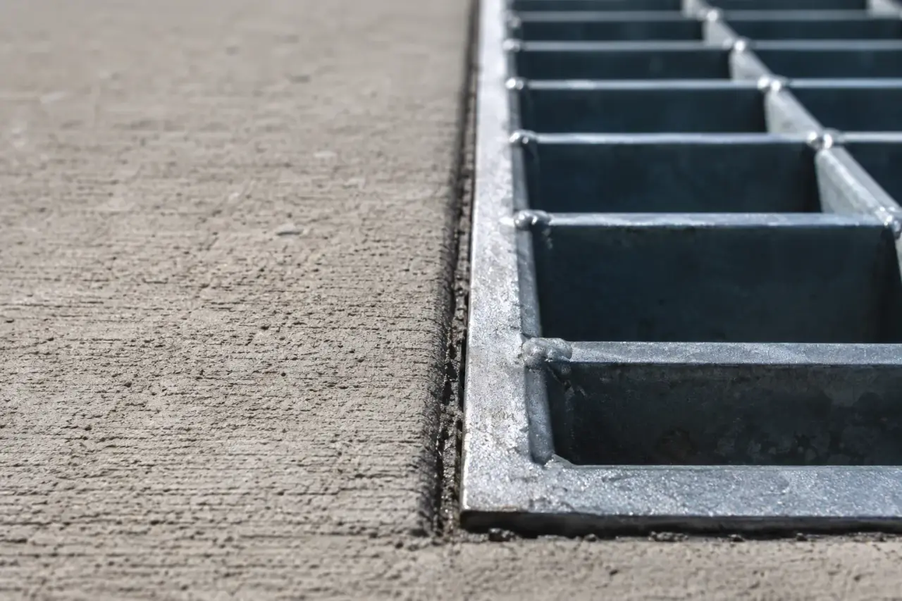Asphalt Repair Around Drains and Grates in Georgetown being fabricated and installed by The Grate Guys