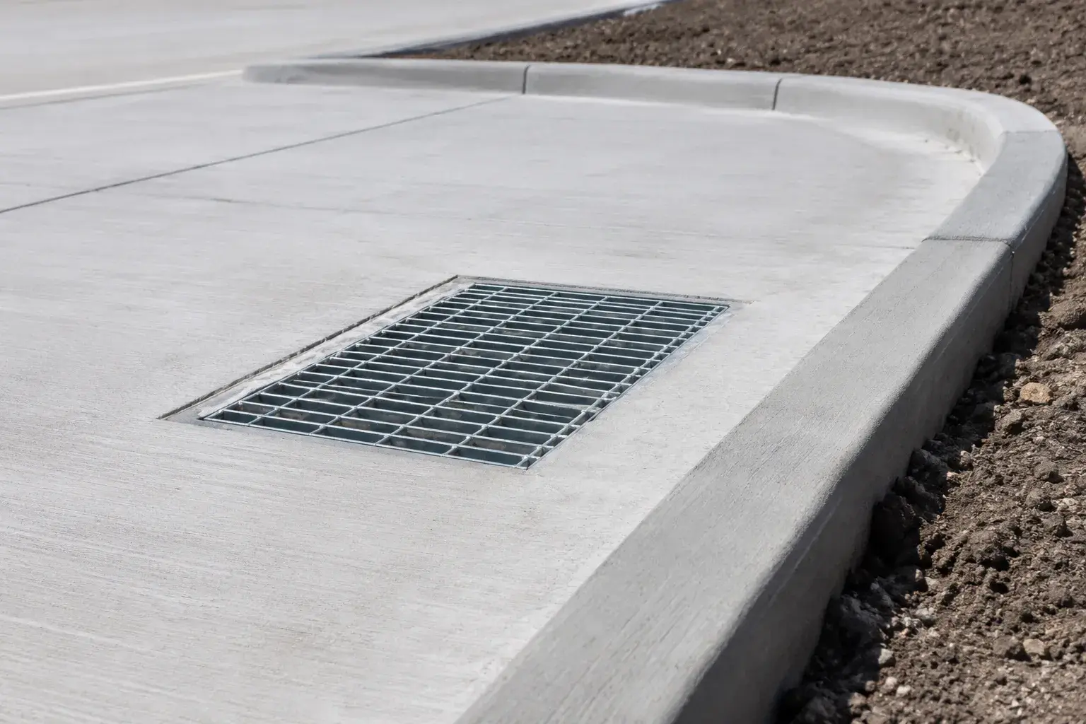 Concrete Curbs, fabricated and installed by The Grate Guys