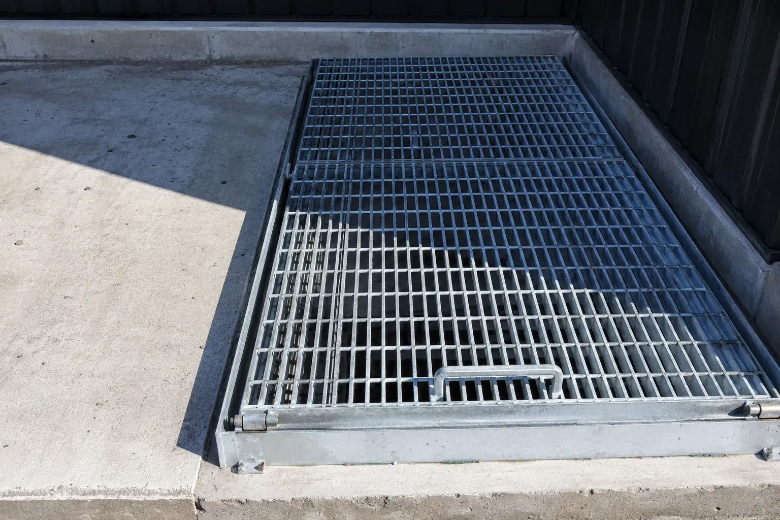 Latched and Hinged Grates, fabricated and installed by The Grate Guys