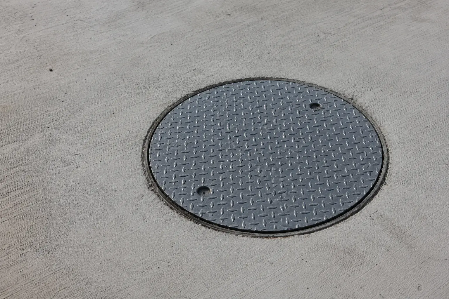 Manhole Covers, fabricated and installed by The Grate Guys