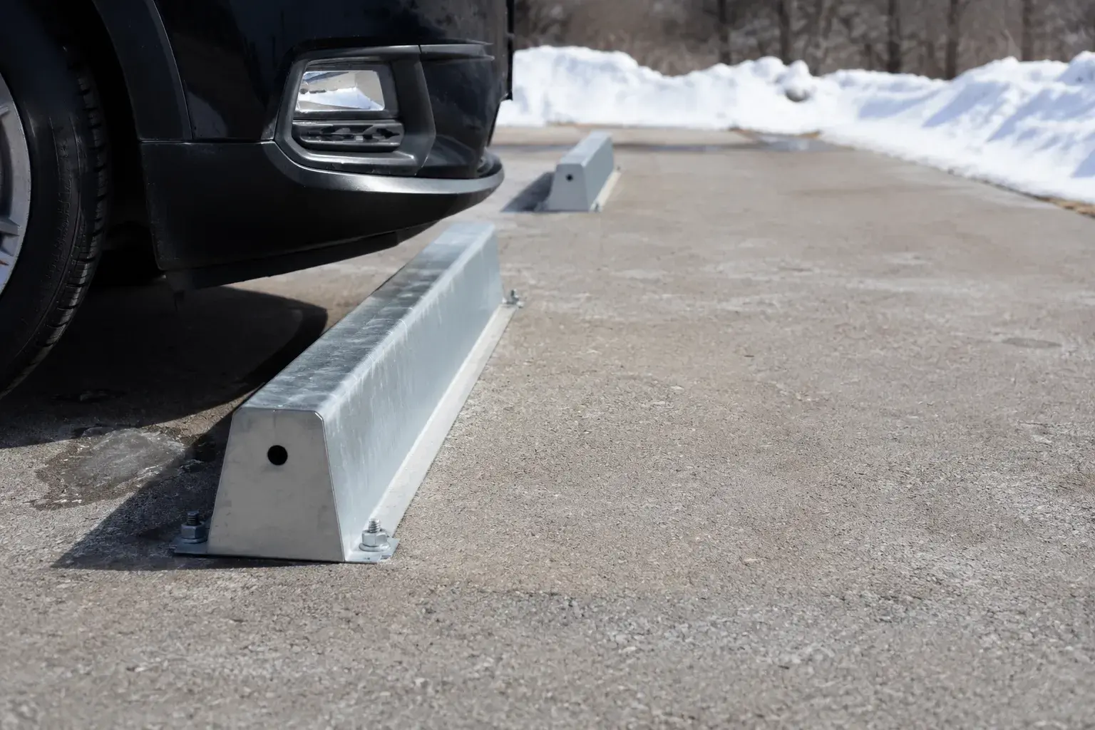Wheel Stops in Caledon, Ontario, fabricated and installed by The Grate Guys